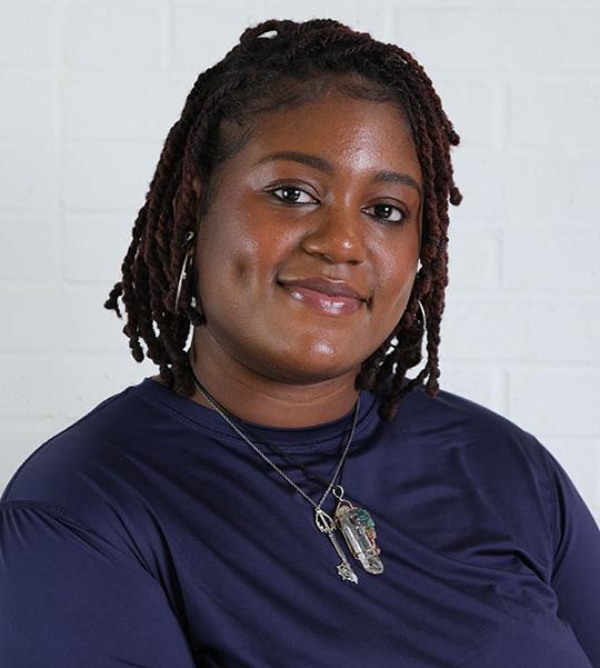 headshot of woman wearing dark tshirt