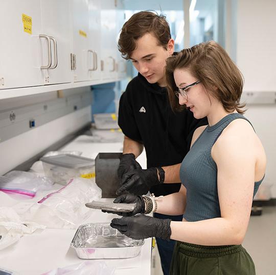 young man and woman in lab