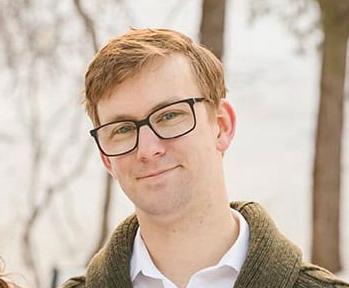 headshot of man with glasses